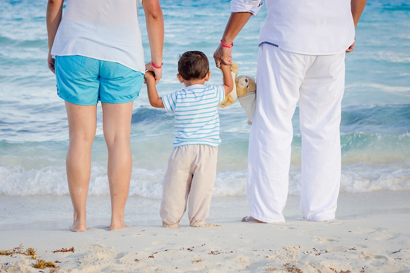 Family Holding Hands at the Beach