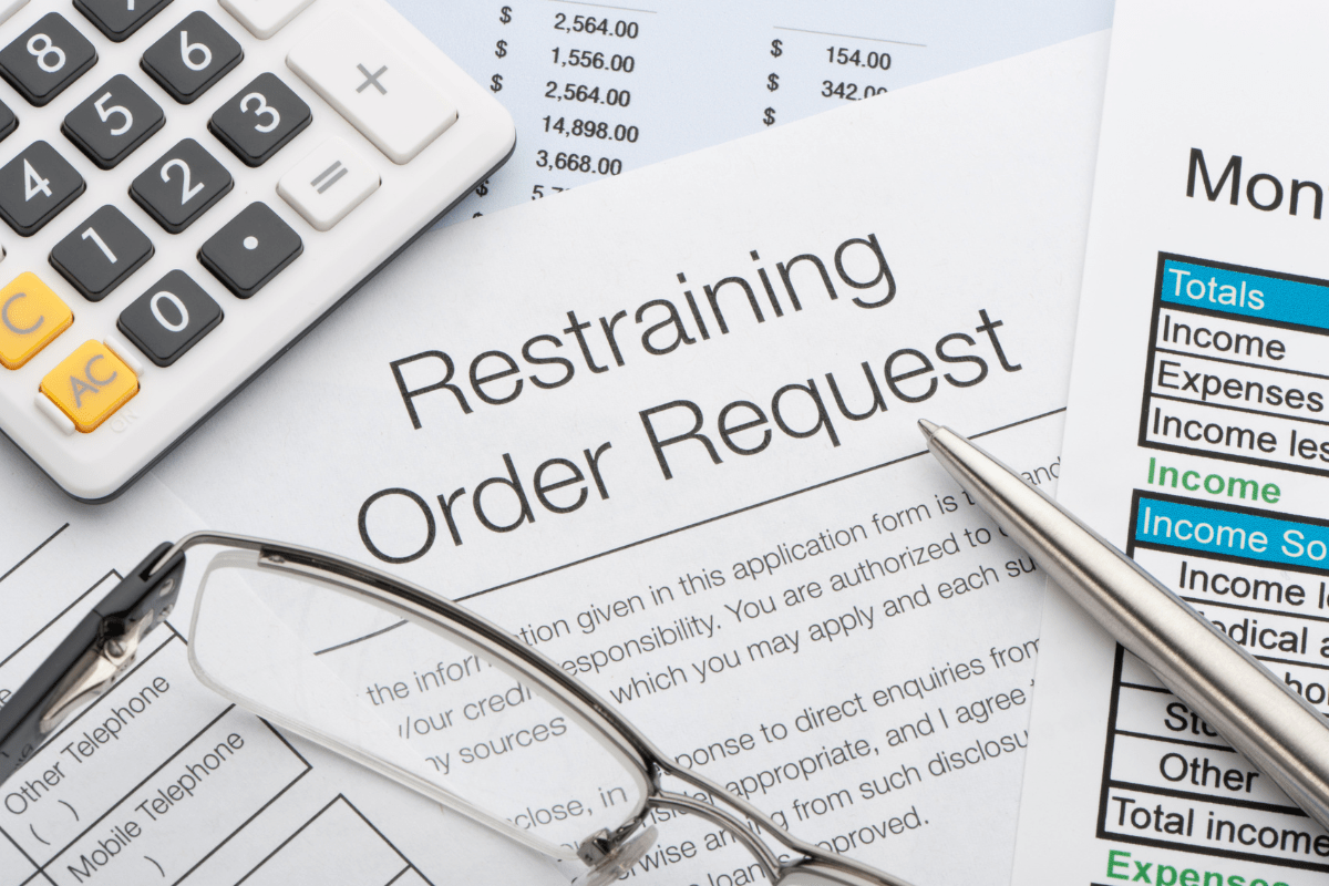 Restraining Order Documents and Glasses