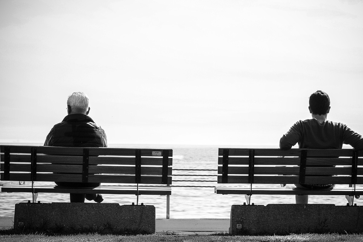 Couple on Benches in Separation