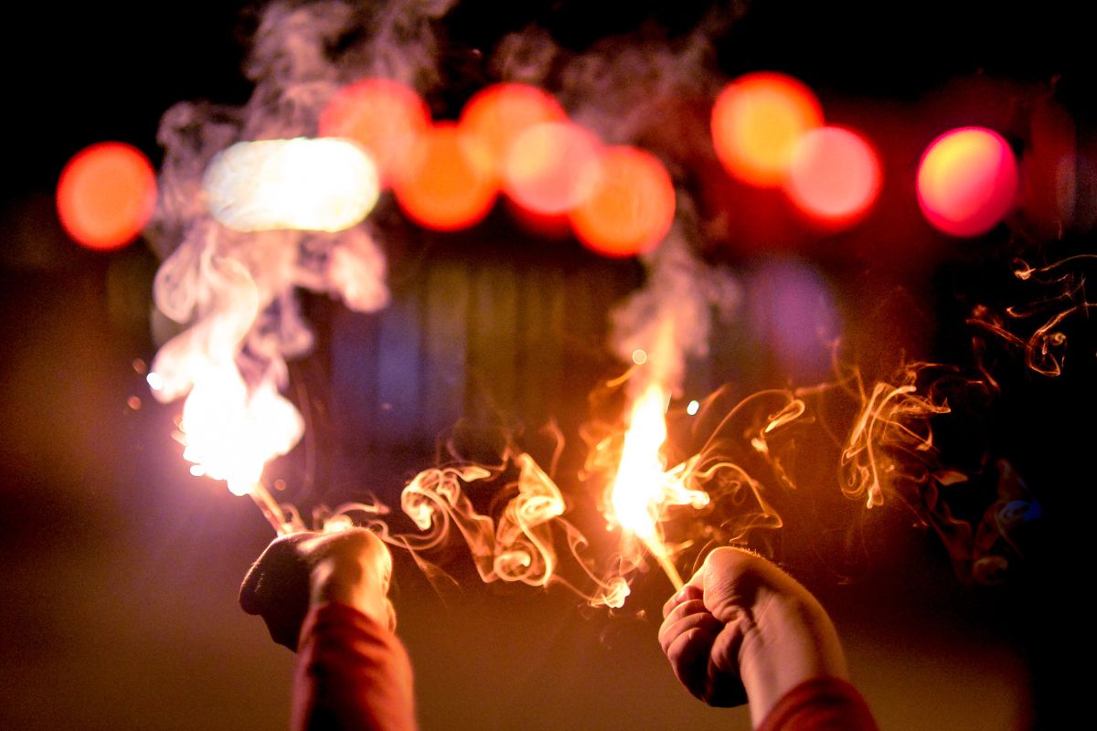 Hands Holding Fireworks