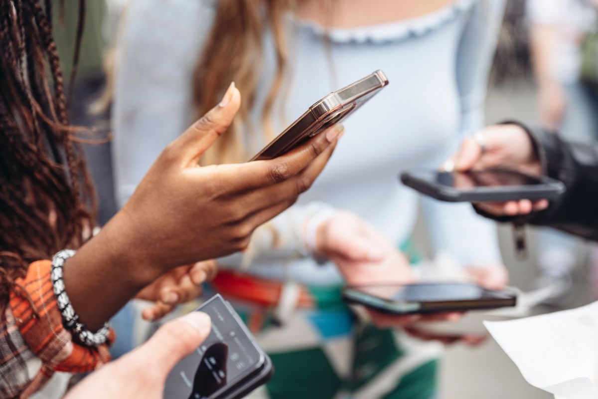 Group Using Social Media on Cellphones