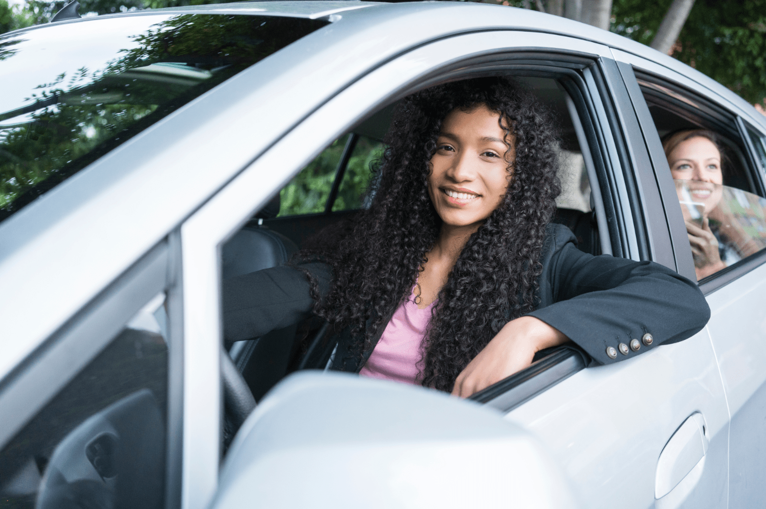 A woman driver and woman passenger