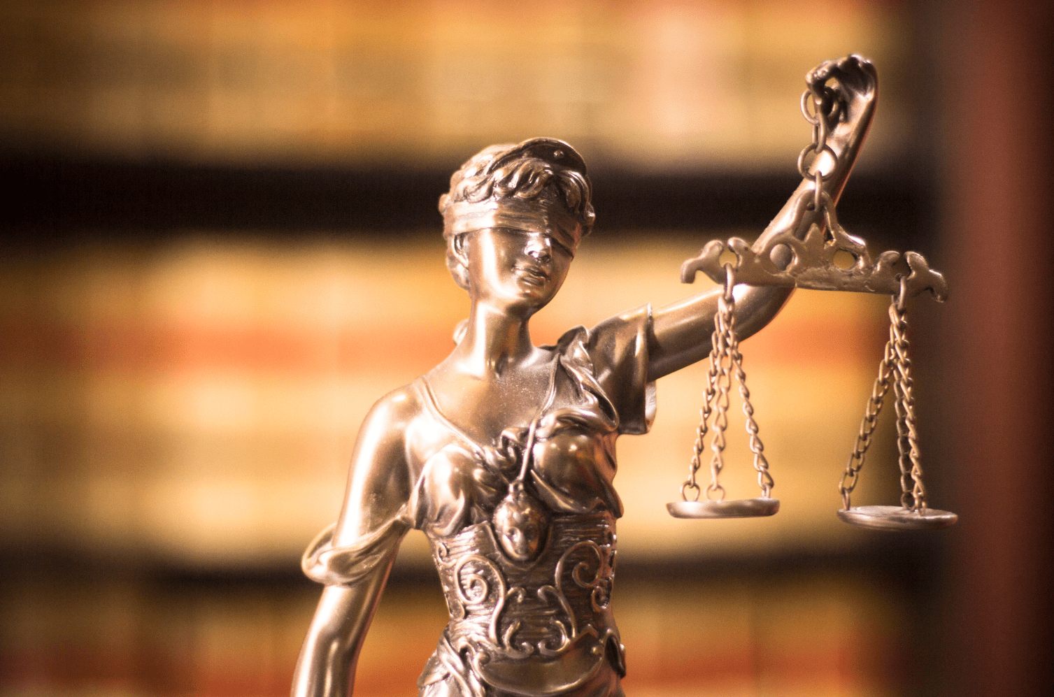 Bronze statue of Lady Justice with scales